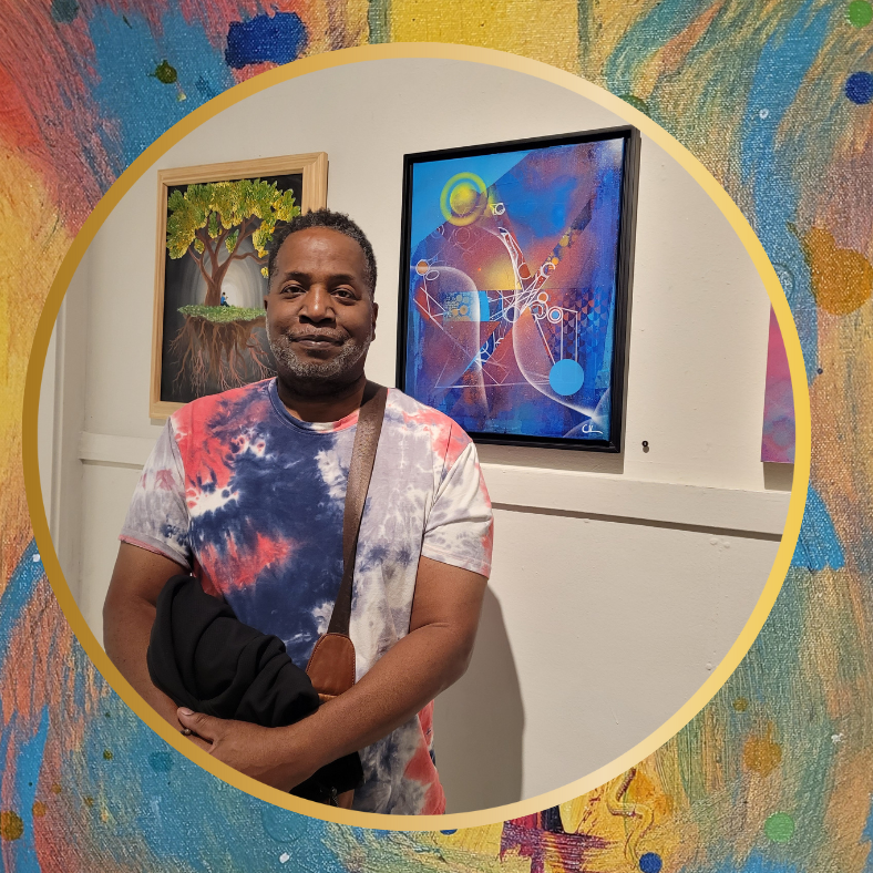 Chris Van Loan Sr stands in front of one of his abstract paintings